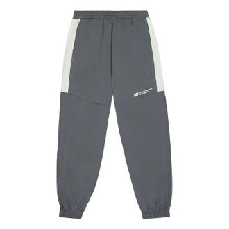 New Balance Woven Track Pants Asia Sizing Dark Grey NTE24031-DKG