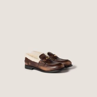 Miu Miu Bleached leather and shearling penny loafers