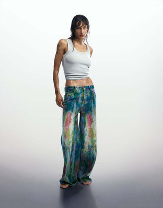 Desigual Jeans a fondo ampio blu con schizzi