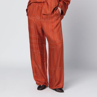 Toteme Monogram Silk Pajama Trousers in Terracotta
