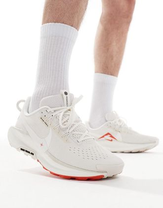 Nike ReactX Pegasus Trail 5 sneakers in white and red